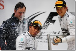 Shanghai International Circuit, Shanghai, China.
Sunday 20 April 2014.
Lewis Hamilton, Mercedes AMG, celebrates on the podium as Nico Rosberg, Mercedes AMG sprays champagne.
World Copyright: Charles Coates/LAT Photographic.
ref: Digital Image _J5R7939