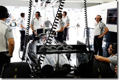 The team work on the car of Kevin Magnussen in the garage.
